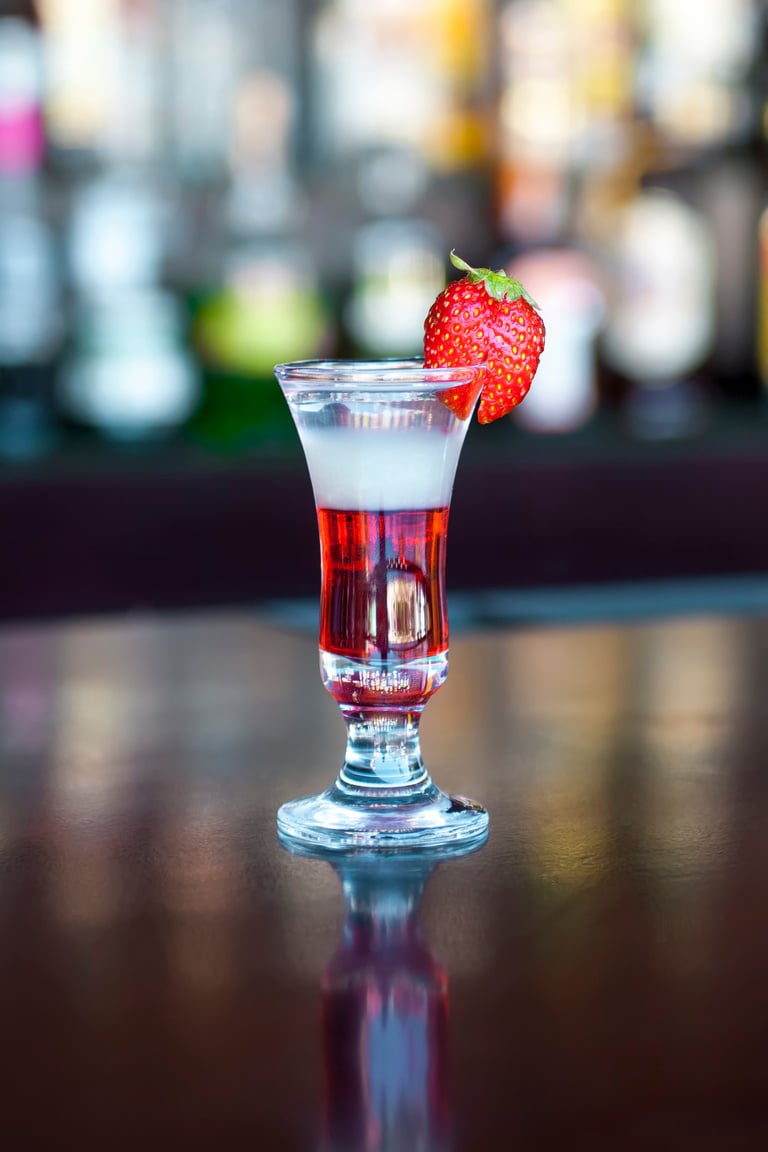 Flash popular shot cocktail on the classic black bar table